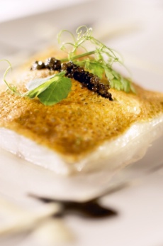 Filet de bar de ligne rti, fine pure dartichaut et galette de sarrasin au caviar, velout dartichaut et jus  lencre de seiche.